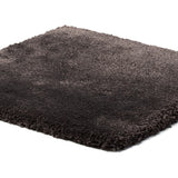 A square dark gray shag rug with a plush, high-pile texture, shown from an elevated perspective on a plain white background.