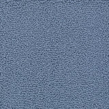 A close-up texture shot of a handtufted rug, showing the looped pile texture in a solid medium blue color.