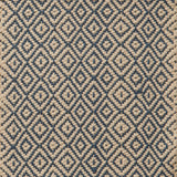 Flatwoven rug in a diamond pattern in blue and cream.