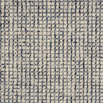 Broadloom carpet in a textural checkered pattern in ivory and blue.