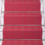 Striped flatweave runner in pink on white staircase