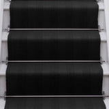 Striped flatweave runner in black on white staircase