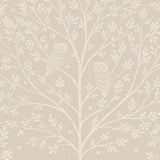 Detail of wallpaper in a repeating owl and tree print in white on a cream field.