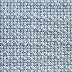 Detail of fabric in a floral grid print in white on a navy field.