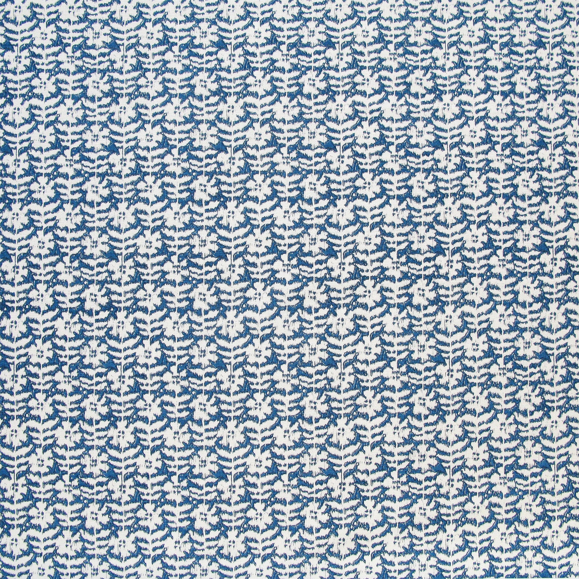 Detail of fabric in a floral grid print in white on a navy field.