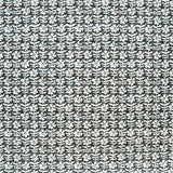 Detail of fabric in a floral grid print in white on a dark brown field.