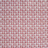 Detail of fabric in a floral grid print in white and maroon on a red field.