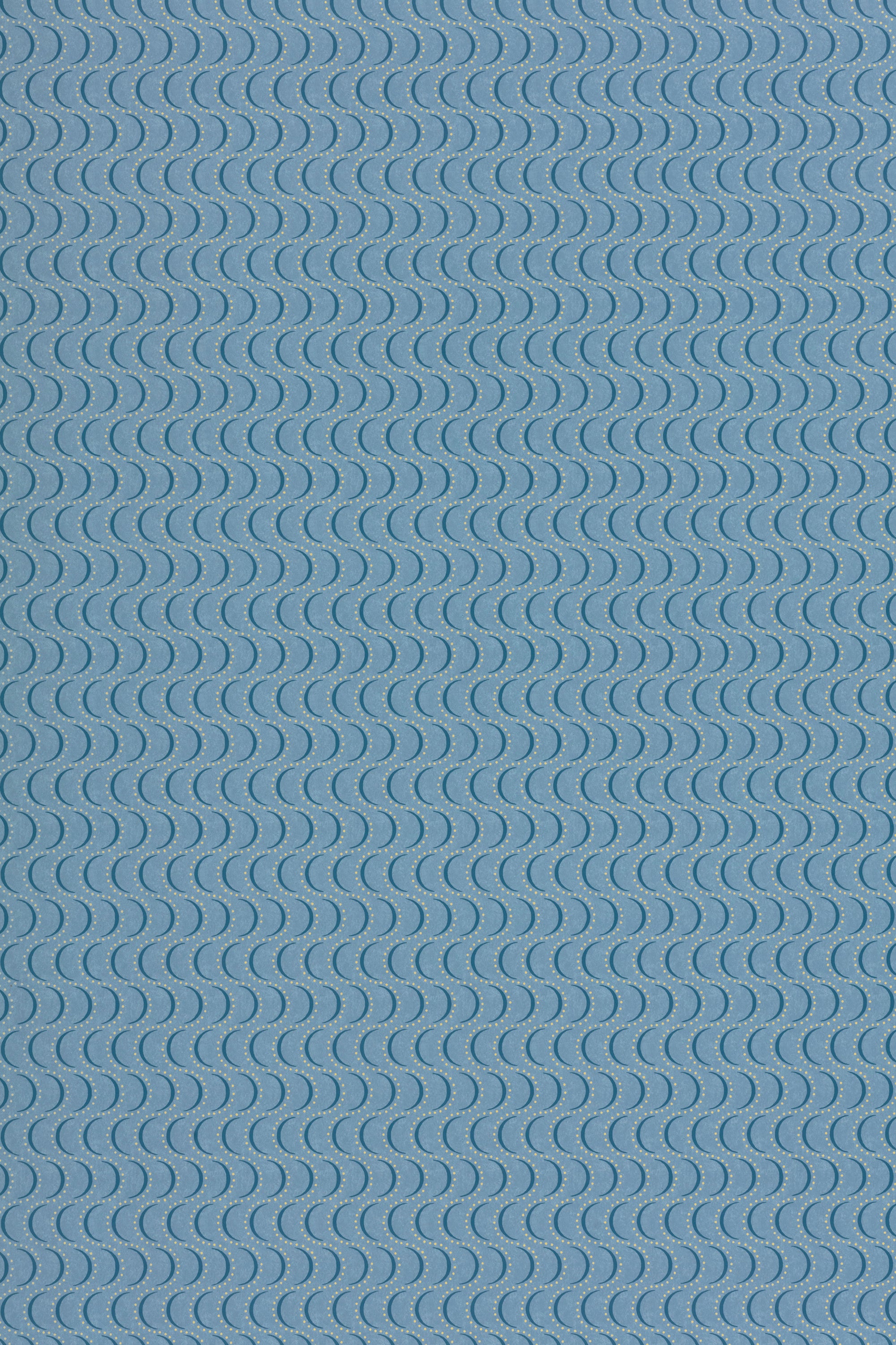 Wallpaper panel in an undulating stripe pattern in yellow and navy on a blue field.