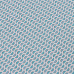 Detail of a wallpaper panel in a linear geometric print in shades of blue and pink on a light blue field.