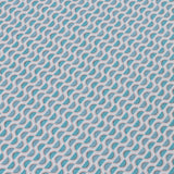 Detail of a wallpaper panel in a linear geometric print in shades of blue and pink on a light blue field.