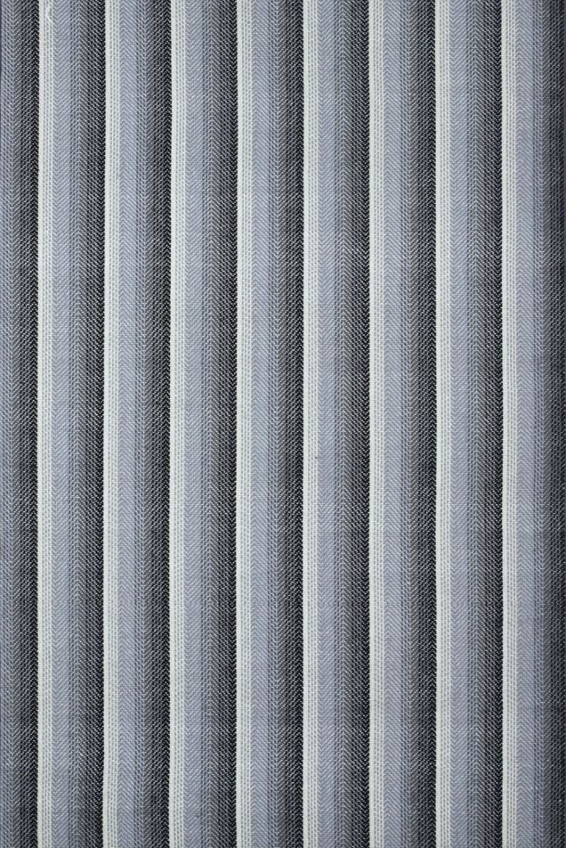 Broadloom carpet in an mixed stripe pattern in black, grey and white.