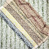 Gently draped fabric cuttings painterly animal print in various colors. 