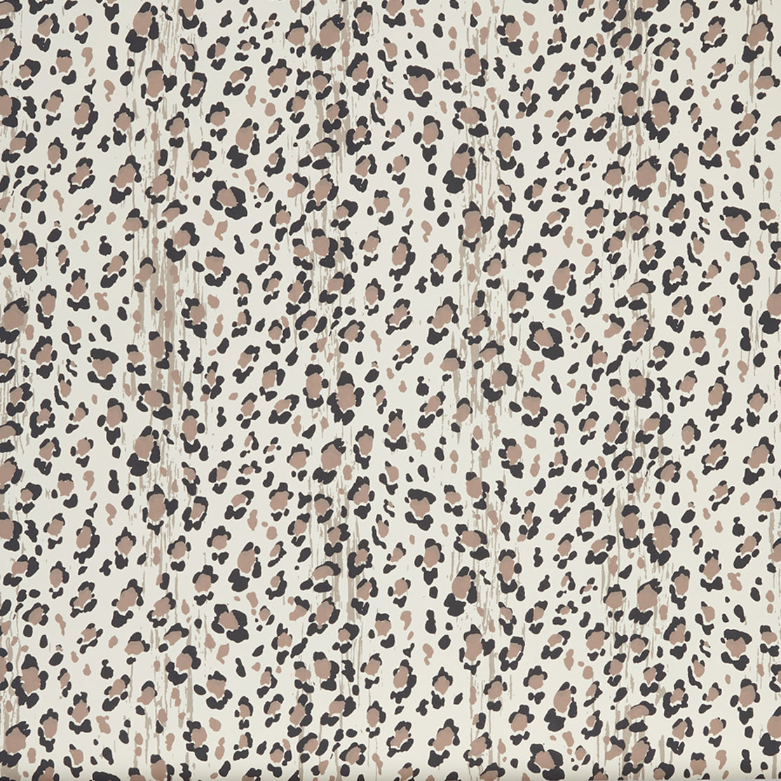Close up of wallpaper with small scale painterly animal print in taupe and black on white.