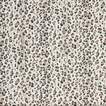 Close up of wallpaper with small scale painterly animal print in taupe and black on white.