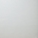 Detail of wallpaper in an abstract grid print in light gray.