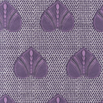 Detail of fabric in a geometric heart print in purple and black on a light purple field.