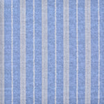 Detail of fabric in a small-scale botanical stripe print in cream on an indigo field.