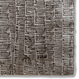 Detail of a hand-painted wallpaper swatch with an undulating ribbon pattern in charcoal on a silver field.