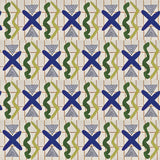 Close up printed wallpaper with green squiggles, white striped triangles, blue X marks on a broken grid in orange on a white background. 