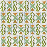 Close up of printed wallpaper with green squiggles, orange striped triangles, light green X marks on a broken grid in blue on a white background. 