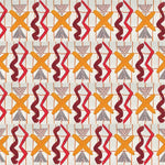 Close up of printed wallpaper with red squiggles, pink striped triangles, orange  X marks on a broken grid in orange on a white background. 