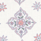 Detail of fabric in a diamond damask print in shades of pink, purple, blue and green on a cream field.
