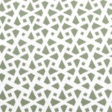 Detail of fabric in a geometric lattice print in sage on a white field.