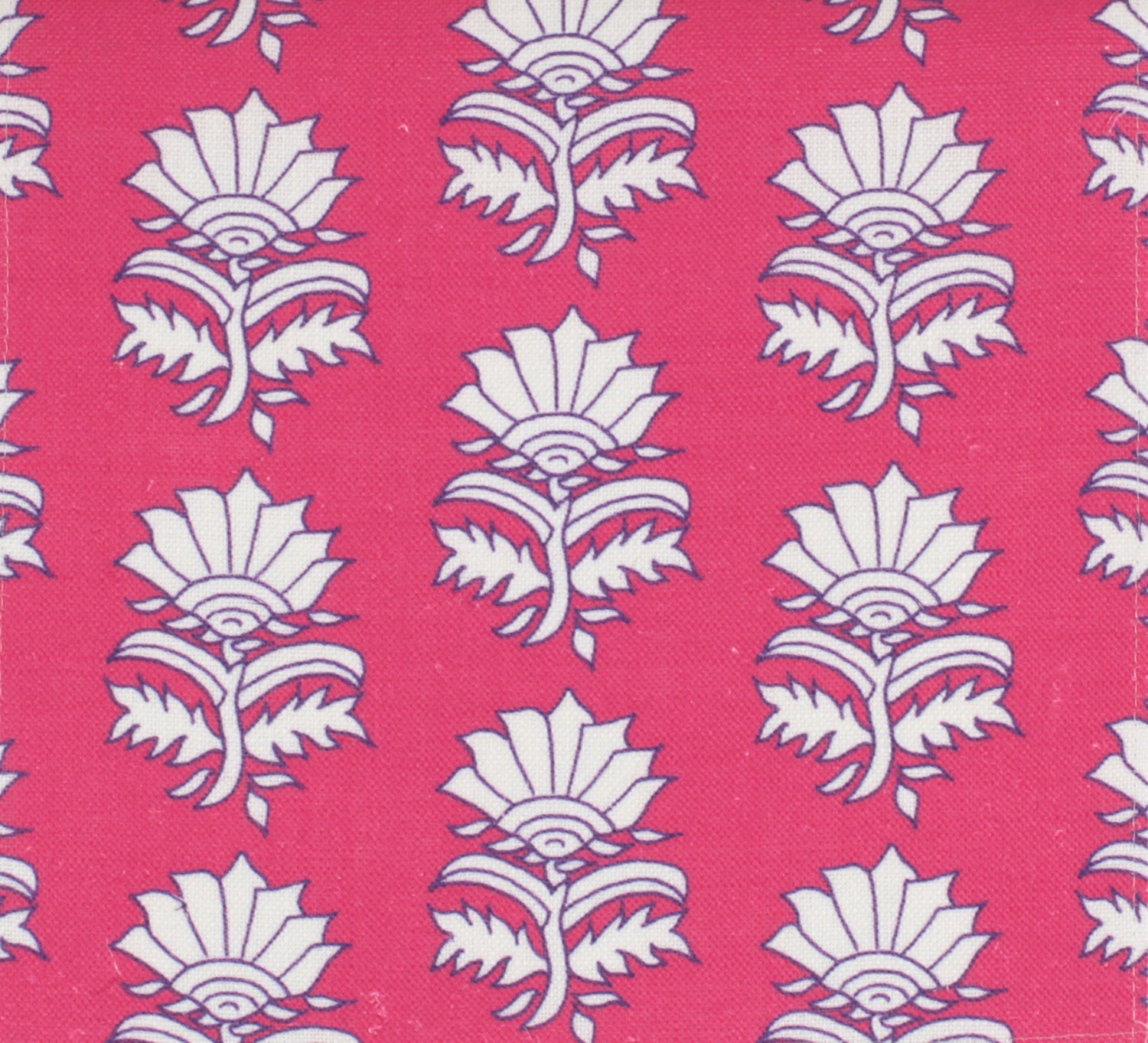 Detail of fabric in a repeating thistle print in white and purple on a fuchsia field.