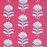 Detail of fabric in a repeating thistle print in white and purple on a fuchsia field.