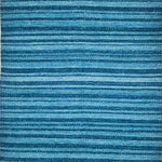 A stripe rug woven in various shades of blue.