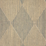 A close-up of a handwoven rug pattern featuring a diamond argyle design in beige and muted gray-blue tones.