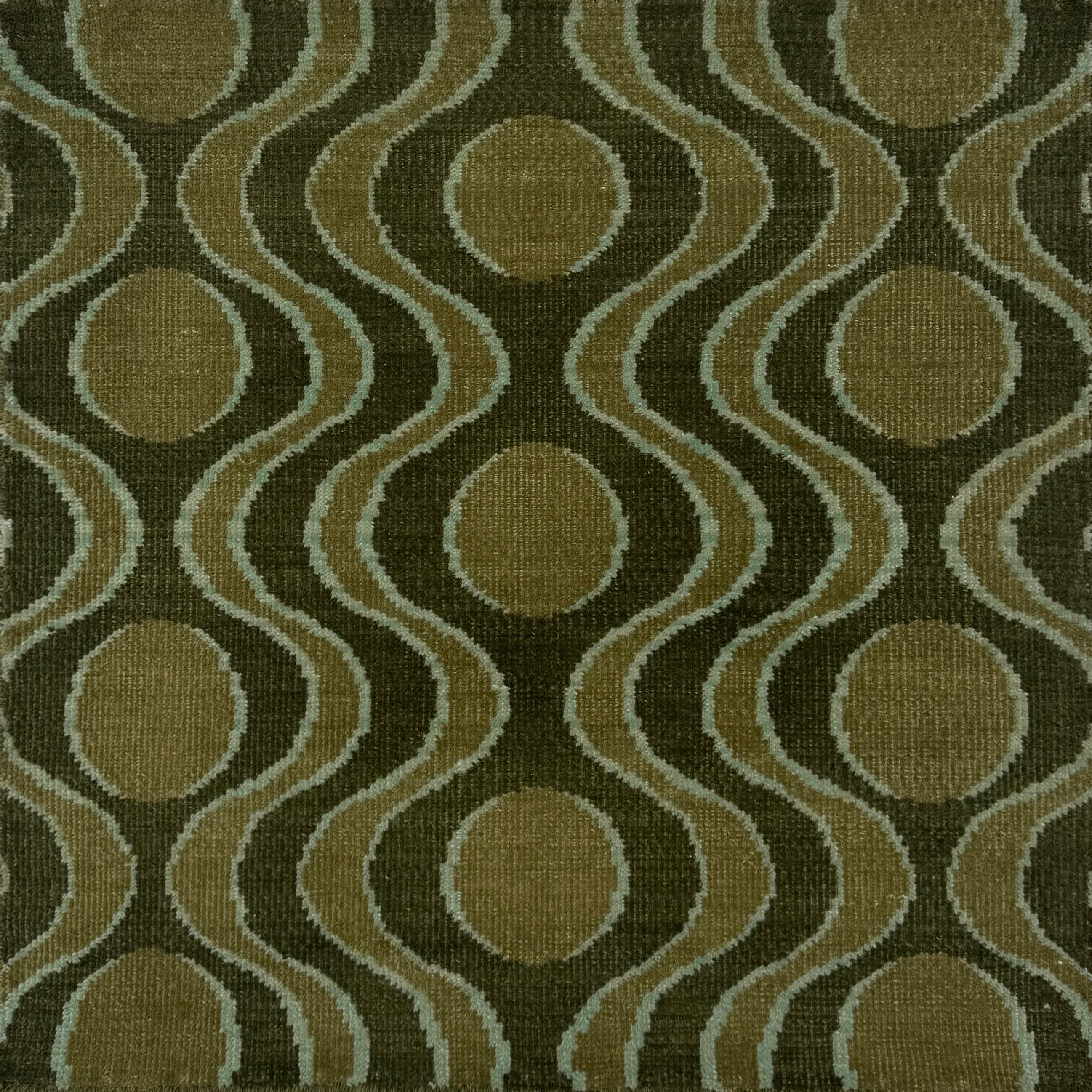 Handknotted rug with retro geo stripe in shades of green with aqua accents. 