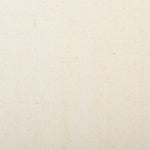 Detail of woven fabric yardage in cream.