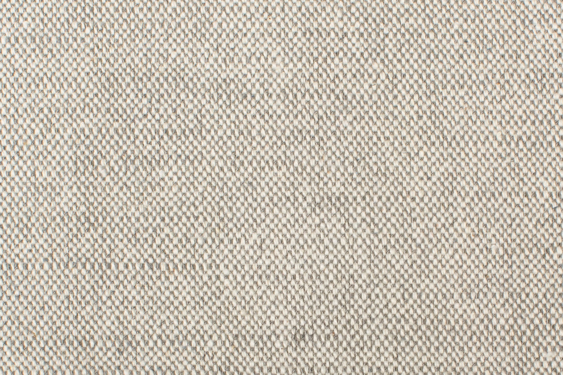 Detail of woven fabric yardage in textured cream and gray.