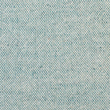 Detail of woven fabric yardage in textured cream and turquoise.