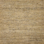 Textured handwoven carpet in beige. 