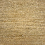 Textured handwoven carpet in cream.