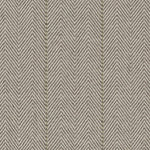 Broadloom carpet in a herringbone in brown with a sage green accent stripe. 