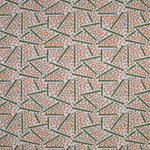 Printed fabric detail in a playful dot and line pattern in coral pink and green