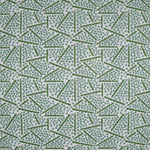 Printed fabric detail in a playful dot and line pattern in  acqua and grass green