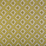 Detail of fabric in a playful floral grid print in yellow and brown on a white field.