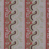 Handwoven silk fabric with scrolling stripe design in pink, red, tan, purple and cream. 