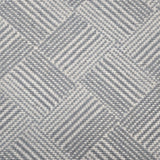 Broadloom rug sample in a diamond pattern in stripes of white and slate blue.