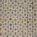 Patterned rug with geometric design in gray and yellow tones