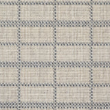 Broadloom carpet detail in plaid grid in shades of blue on a beige field.