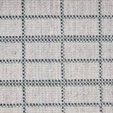 Broadloom carpet detail in plaid grid in shades of green on a beige field.