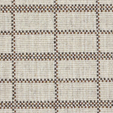 Broadloom carpet detail in plaid grid in shades of burnt sienna on a beige field.