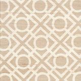 Detail of fabric in a geometric lattice print in tan on a cream field.