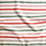 Close up of gently draped striped woven Indoor-Outdoor fabric in white, dark green, pink, coral red and sage green.