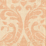 Detail of fabric in a botanical and bird print in pink on a cream field.